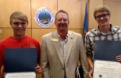 COUNTY BOARD YOUTH DELEGATES RECOGNITION: County Board Chairman Mark Liebaert (center) gave certificates of appreciation to youth delegates Dustin Soyring (left) and Nathan Lindahl (right).
